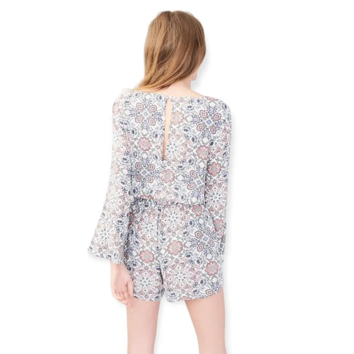 Floral V-neck long sleeve shorts romper with bell sleeves on model back view