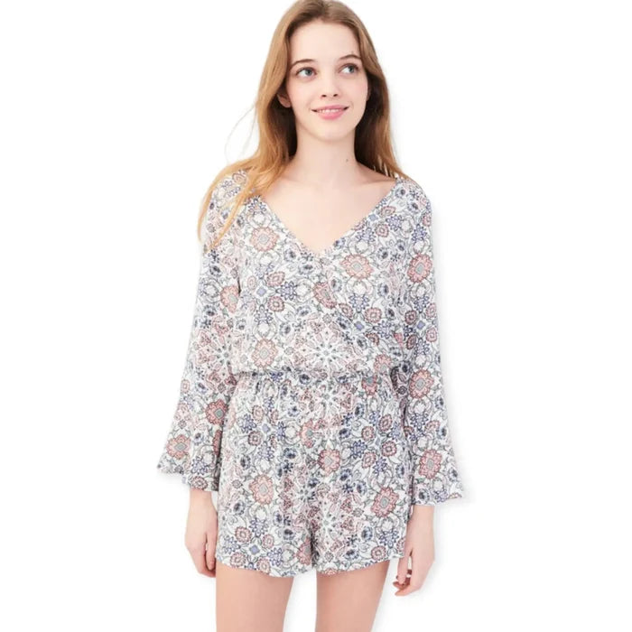 Floral V-neck long sleeve shorts romper with bell sleeves on model