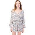 Floral V-neck long sleeve shorts romper with bell sleeves on model