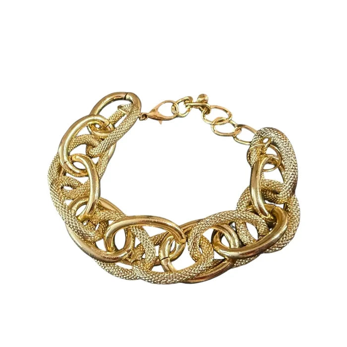 Gilded Gold Textured Bold Link Bracelet with chunky intertwined oval links and adjustable lobster clasp flat lay
