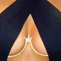 Model wearing under black crop top Glam Crown Jewel Chest Body Chain with silver rhinestone crown pendant, under-chest bracket design, and adjustable waist chains