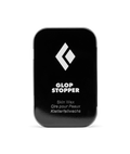 Black container of Glop Stopper skin wax with a white logo on a white background