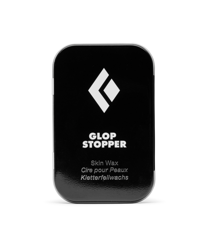 Black container of Glop Stopper skin wax with a white logo on a white background