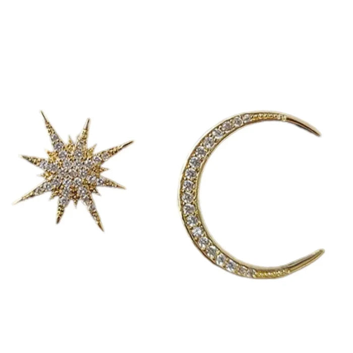 Gold Asymmetric Sparkle Moon & Star Stud Earrings with golden sparkle crescent moon and starburst designs.