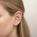 woman wearing Gold Cosmic Helix Hook Pin Earring with crystal crescent, ear wrap hook, and long pin for pierced ears