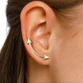 woman wearing Gold Dual Arrow Crawler Earrings with minimalist slider design and boho western arrow detail one size