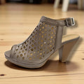 Gray laser cut ankle strap heels with peep toe, slingback fit and sculpted brown woodgrain cone heel