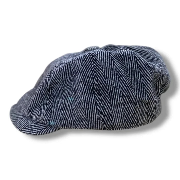 Gray tweed herringbone newsboy cap with short stiff brim and button top, styled as a vintage men’s flat cap.