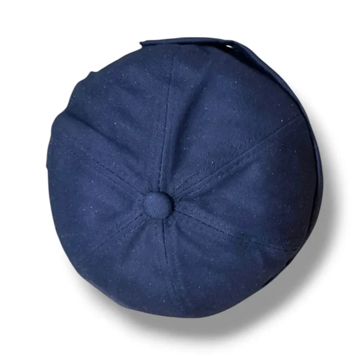 flat lay Harbour Cotton Docker No Brim Cap in navy rolled edge, eyelets, button top, and adjustable strap osfm / unisex