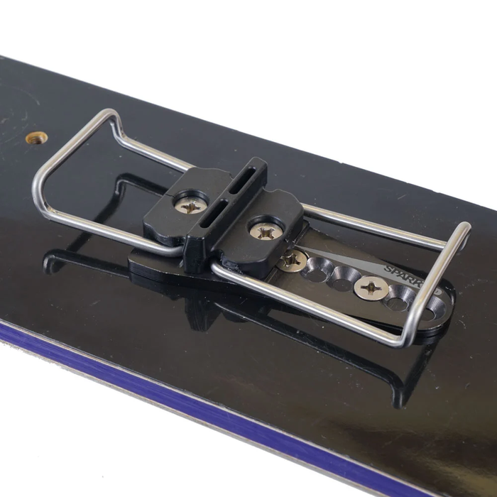 Close-up of a snowboard deck with a metal plate and screws on a white background