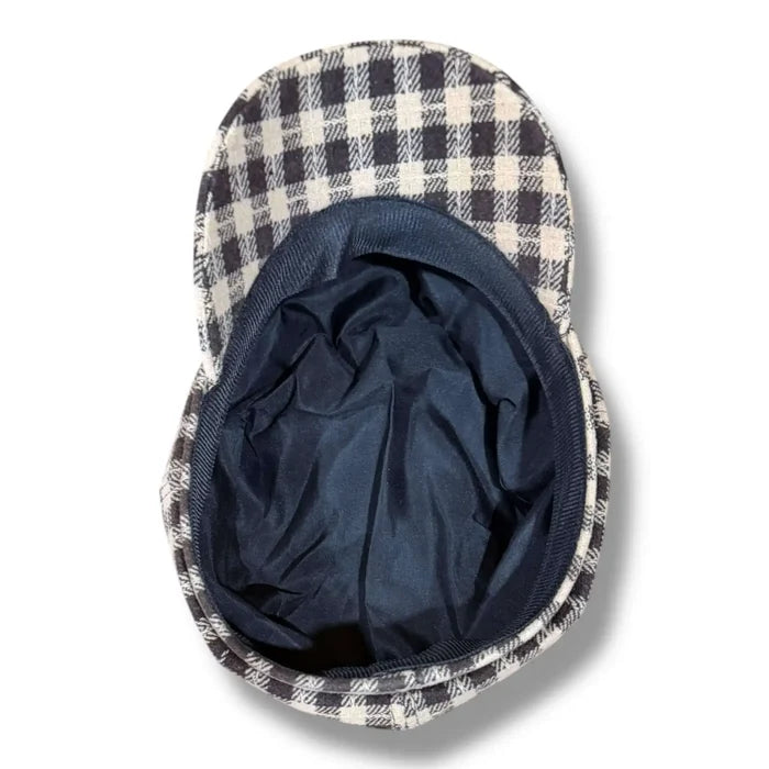 Underneath flat lay Heritage Checks Baker Boy Cap in brown cream tweed with 8 panel crown and curved brim / one size