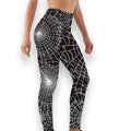 Black leggings with white spiderweb pattern—side profile on model