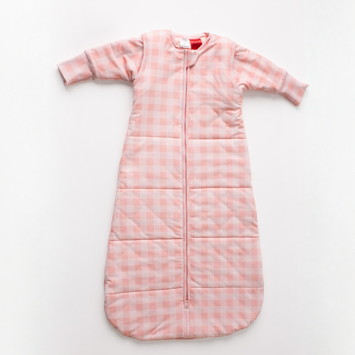 Pink gingham infant sleep sack with detachable sleeves attached, laid flat