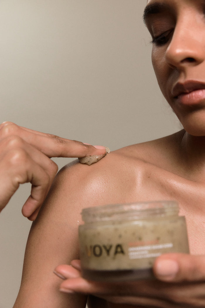 Iridescence Awakening Peppermint Sugar Scrub on shoulder