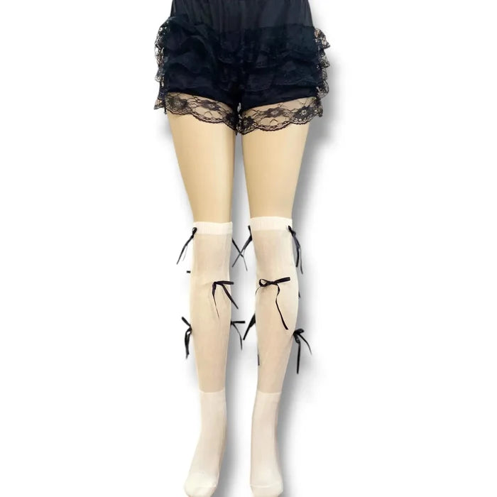 Knee High Socks with Long Bow Ribbons featuring ribbed knit texture and oversized satin bow details