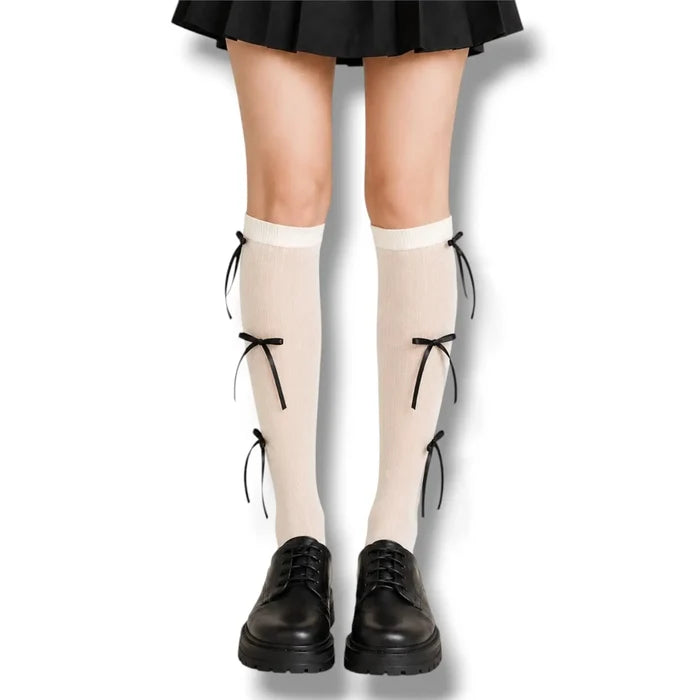 Knee High Socks with Long Bow Ribbons featuring ribbed knit texture and oversized satin bow details