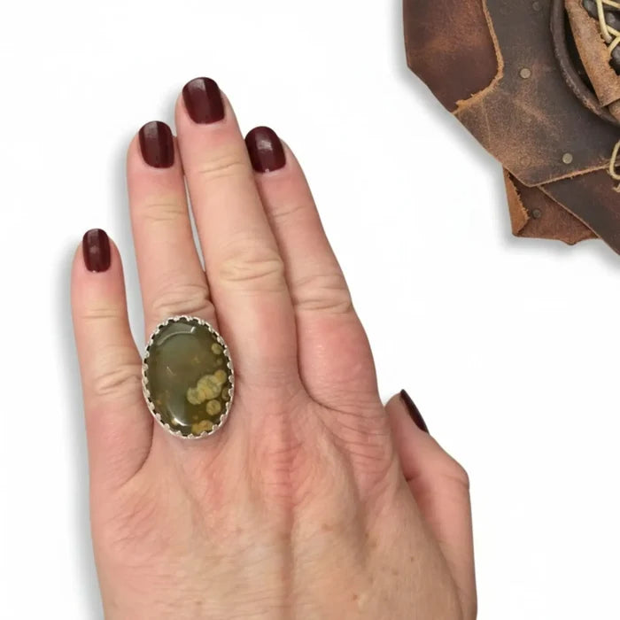 Large Fossil Jasper sterling silver ring with green-yellow cabochon, crown bezel and floral textured band 8.75