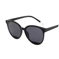Large round cat eye sunglasses with waterline-textured lenses and metallic legs – bold retro style for festivals, skiing, or streetwear looks