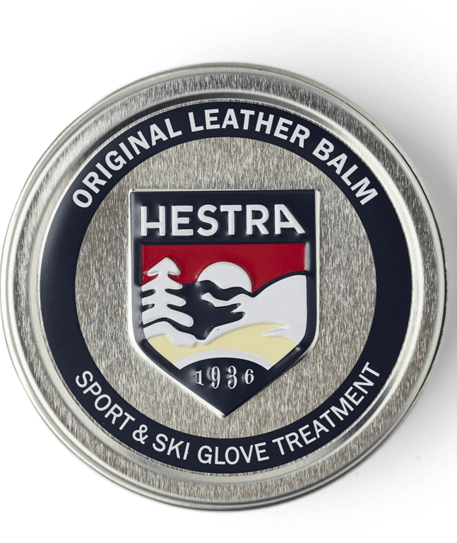 Hestra leather balm container with logo on a transparent background