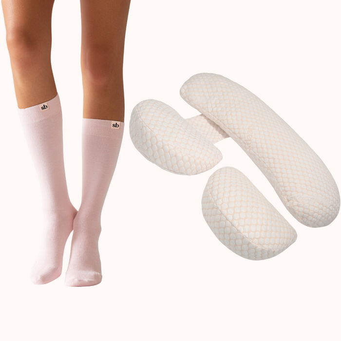 Light Legs Sleep Bundle: pale pink maternity compression socks beside the adjustable three-piece pregnancy pillow