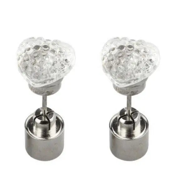 Clear close-up glowing LED heart post earrings with stainless steel backings on white background