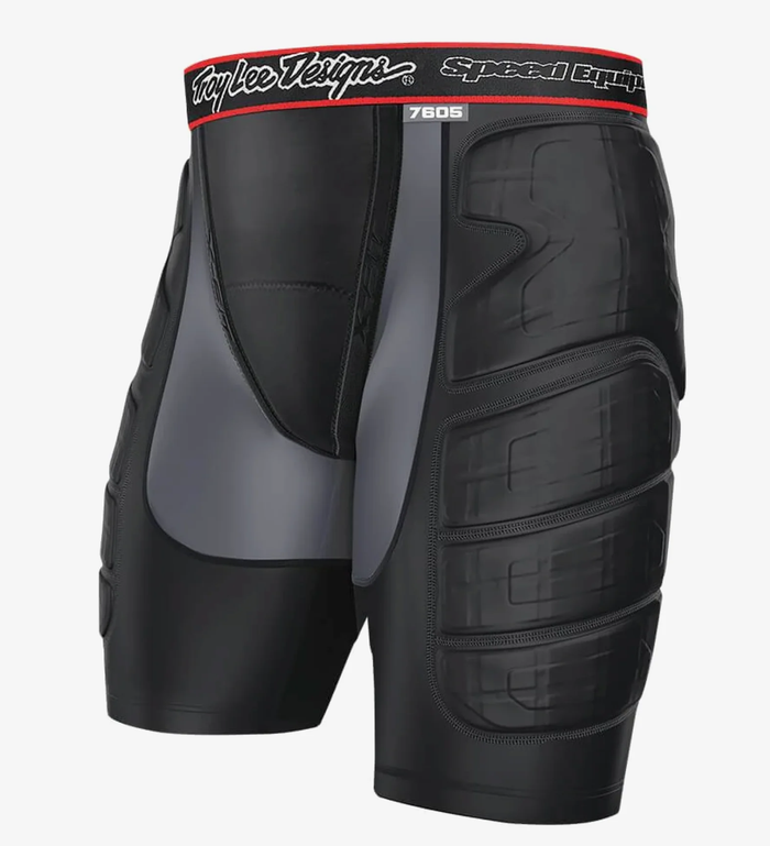 Black protective shorts with padding on a white background