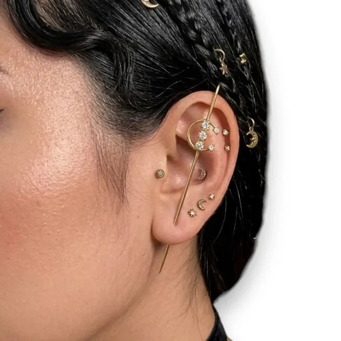 woman wearing gold Lunar Moon Star Ear Hook Pins with crystal crescent moon, star charms, and gold or silver ear crawler style