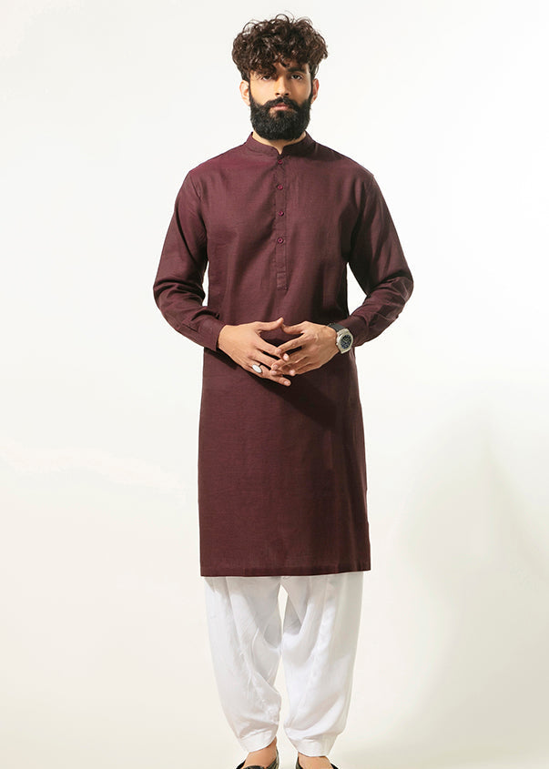 Men's burgundy long kurta with mandarin collar and front buttons, paired with white pants