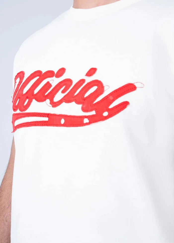 Men's off-white T-shirt with red script logo graphic, close-up