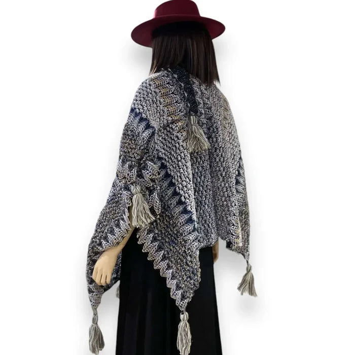 mannequin wearing gray blue Multicolor Knit Poncho Wrap with colorful loom-knit pattern and large tassels