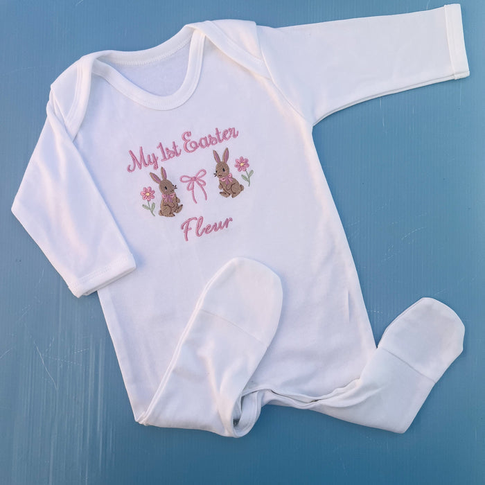 Baby romper with my first Easter embroidered in pink with a bunny, bow and some flowers