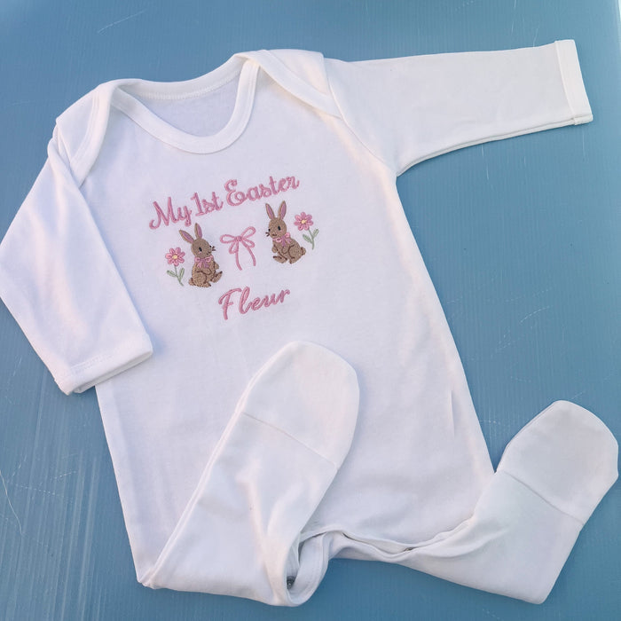 Baby romper with my first Easter embroidered in pink with a bunny, bow and some flowers