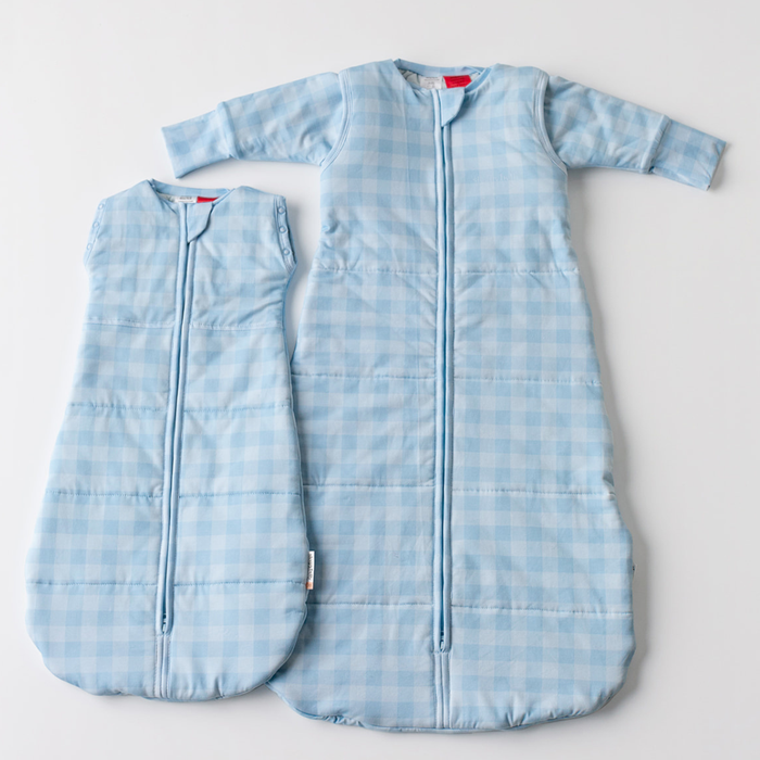 Blue gingham newborn swaddle sack and infant sleep sack laid flat — Newborn to Infant Sleep Sack Bundle