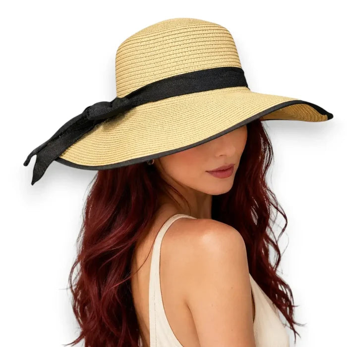 Model wearing the Beige Oversized Wide Linen Bow Straw Hat for beach and resort sun protection