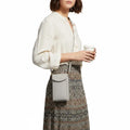woman carrying Phone Wallet Mini Crossbody Bag with front phone pocket and adjustable strap gray / women's/ one size