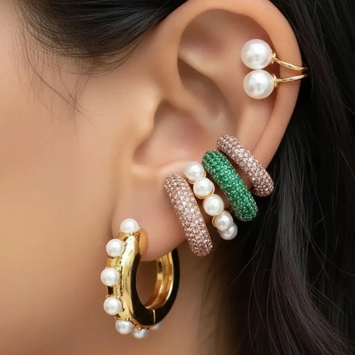 Woman wearing 3 Pavé Gold Ear Cuff Set with chunky crystal no-piercing cuffs