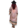 women's wearing wide brim hat with pink flamingo print kimono beach cover up with floral design and sash / one size fits most