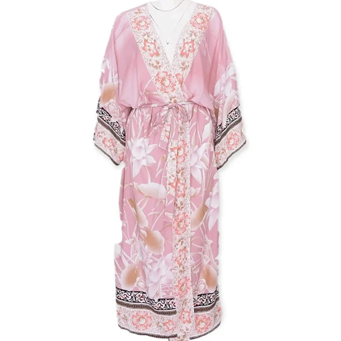 women's wearing wide brim hat with pink flamingo print kimono beach cover up with floral design and sash / one size fits most
