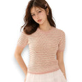 woman wearing Pink White Striped Crochet Short Sleeve Top with open-stitch cotton knit, crew neckline, ribbed trim, and hip-length fit