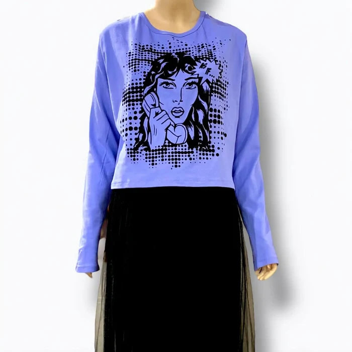model wearing plus size blue delia’s style long sleeve graphic tee