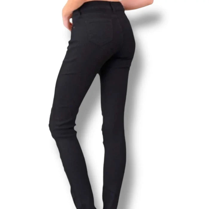 Plus size mid rise black ripped skinny jeans with distressed detail and triple button closure