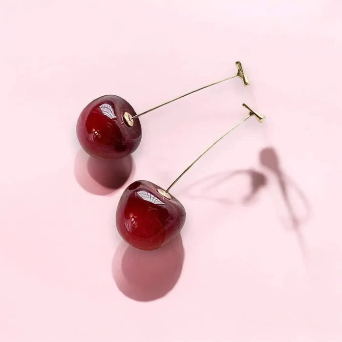 earrings styled with minimal outfit for pop of color flat lay
