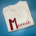 Red glitter initial sweatshirt with red embroidered name