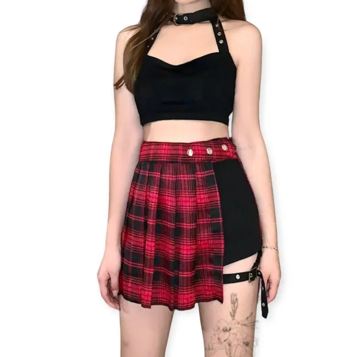 Red plaid pleated mini skirt with black and gold threading, silver snaps, and adjustable black leg strap. Plus size, punk gothic style with hidden black shorts lining.