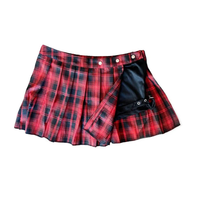 Red plaid pleated mini skirt with black and gold threading, silver snaps, and adjustable black leg strap. Plus size, punk gothic style with hidden black shorts lining.