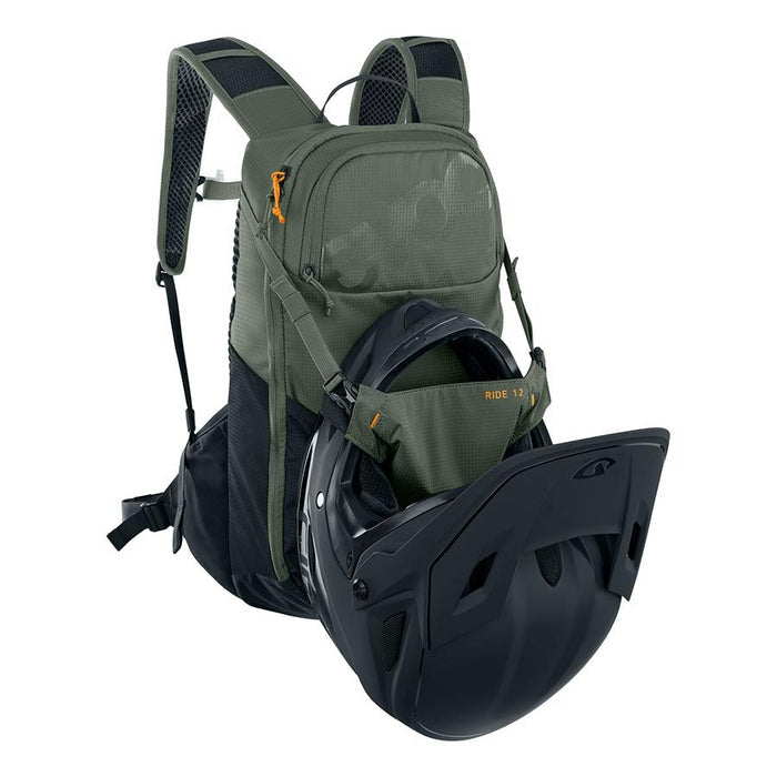 Green backpack with a helmet inside on a white background