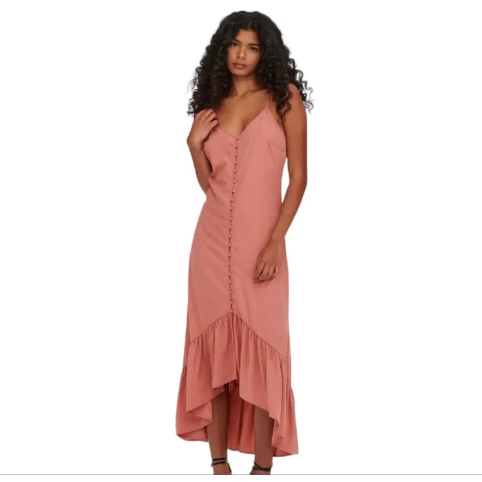 Rose pink sleeveless maxi dress with button-down front, crisscross back, and high-low ruffle hem, styled for boho western summer fashion
