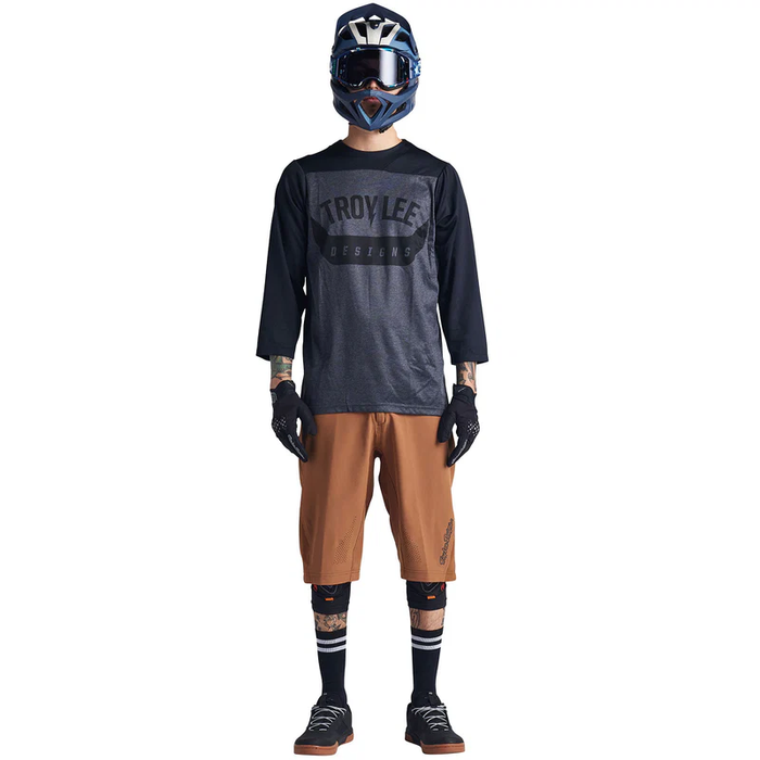 Person wearing Troy Lee Designs cycling gear on a white background