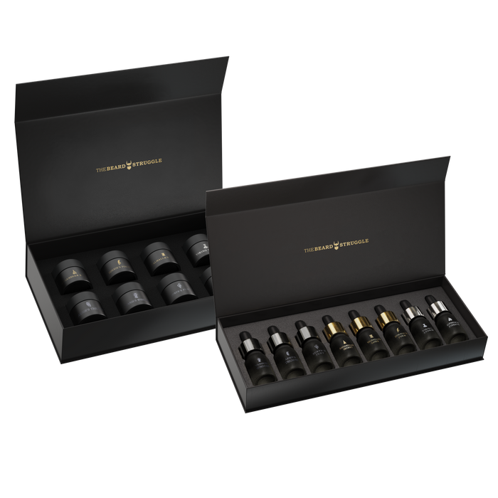 Scent Raider Sample Kit by The Beard Struggle, two open black gift boxes holding eight beard oil sample bottles and eight beard balm sample jars