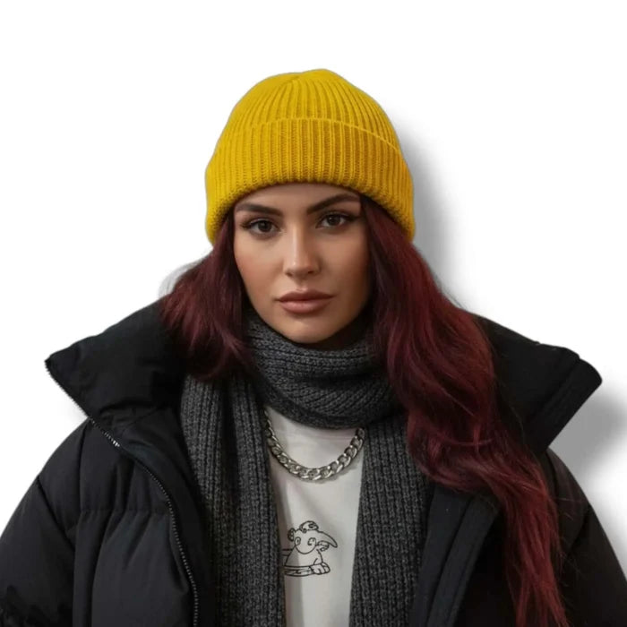 model wearing yellow Short Fisherman Beanie Skull Cap solid colors chunky rib knit, rolled cuff, short fit, and unisex skull cap style